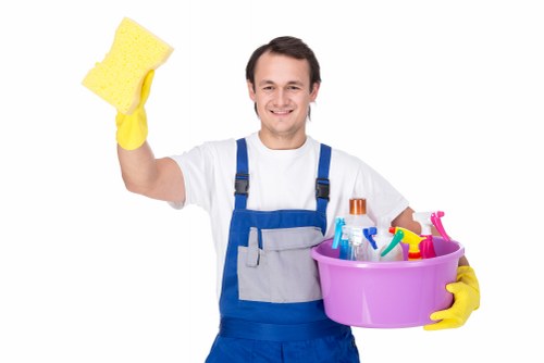 Cleaner maintaining a tidy commercial workspace in SE1