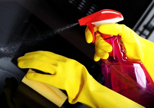 Cleaner wearing protective gear while handling chemicals